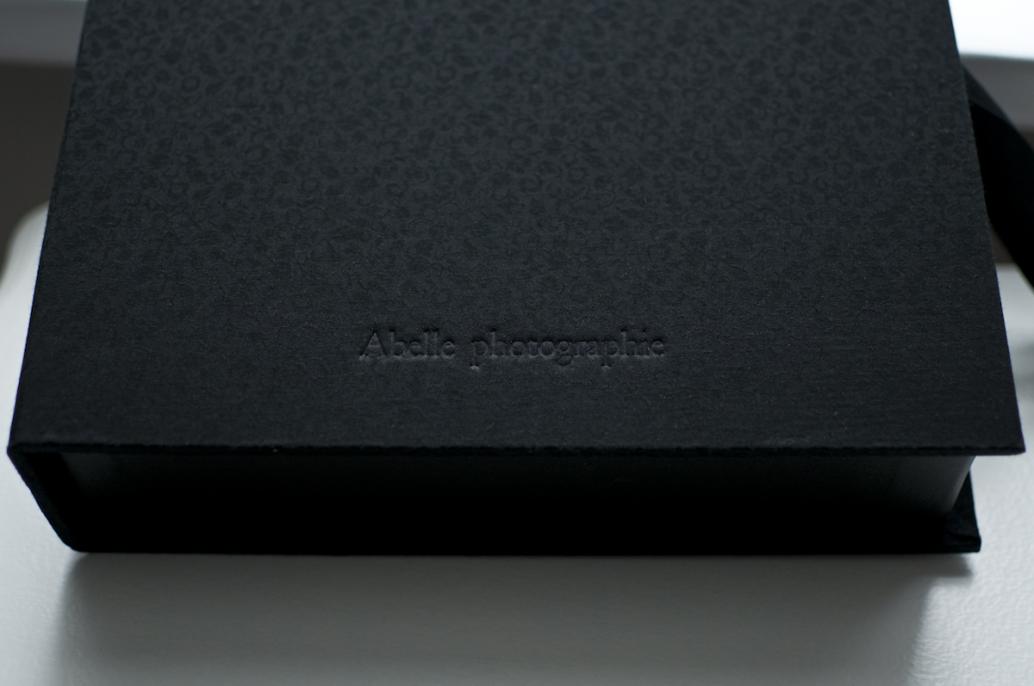 Optional embossing shown on black brocade cover.