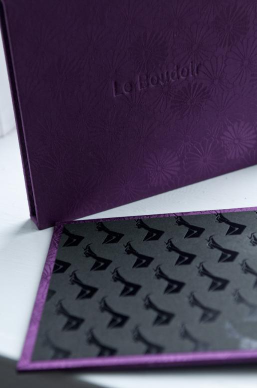 Boudoir album details in purple silk brocade.